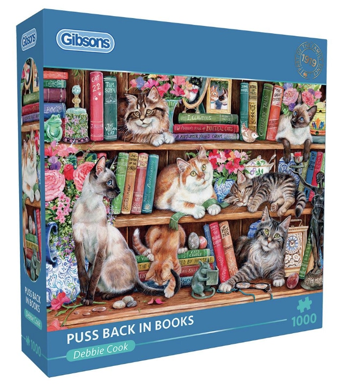 Jigsaw puzzle design of cats and books by debbie cook for art licensing