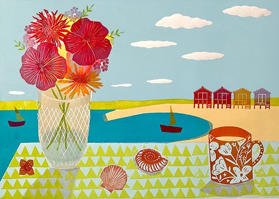 Colourful lino print of a table with flowers and shells and a view to the sea with boats and beach huts